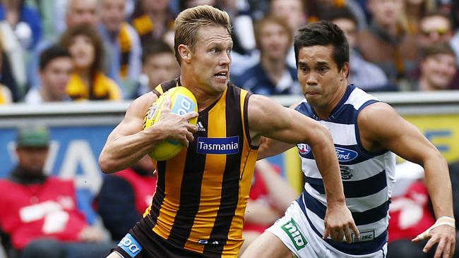 Mitchell shows Mathew Stokes a clean pair of heels in a match against Geelong in 2013.