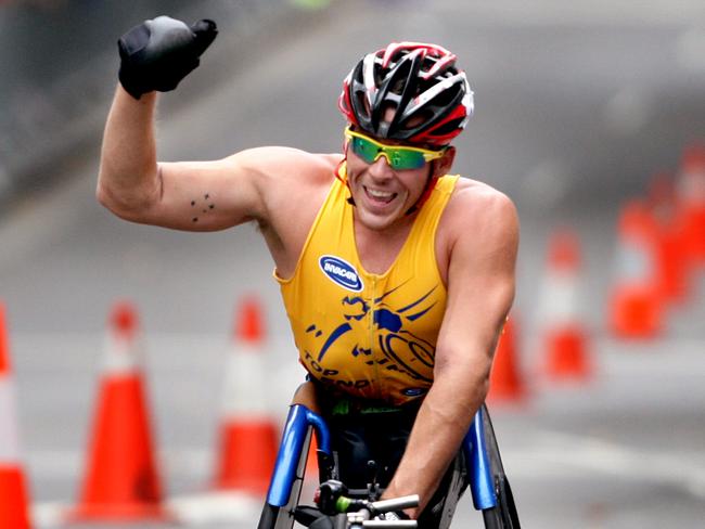 First again ... Fearnley celebrates as he crosses the finish line for one his favourite events, the Oz Day 10K Wheelchair Race in The Rocks, Sydney.