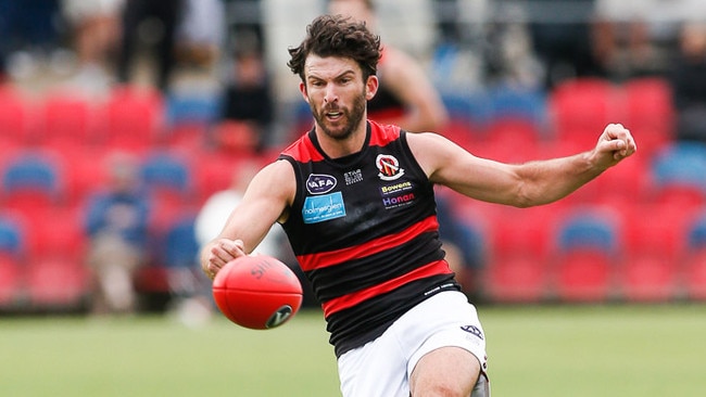 Rohan Bewick takes a kick for Old Xavs during his stunning match against St Bernard’s. Photo © Panagiotis Kasseris