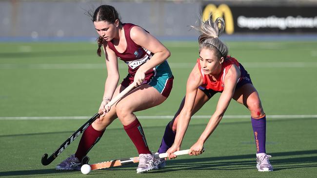 Brothers’ Shaylee Atkinson and Stingers’ Jess Watson fight for possession in the Cairns Hockey Association A-grade women's match between Brothers and Trinity Stingers. PICTURE: BRENDAN RADKE