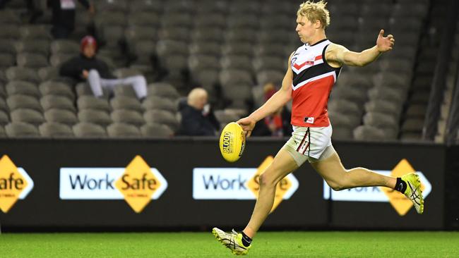 Leigh Williams boots one of his seven goals. Picture: James Ross/AAP