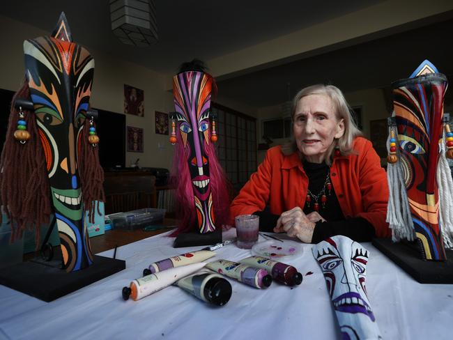 26/6/24: Liz Parkinson at her home in Nth Avoca. Liz 78, has been making colourful, unusual masks from recycled material, beads and jewellery for 15 years and has been invited to exhibit them again in Canada next June.But she was prohibited from showing them at Gosford's Regional Gallery in late 2022 because the director of the gallery deemed them culturally appropriated. He also disallowed the exhibition of locally woven baskets for the same reason. John Feder/The Australian