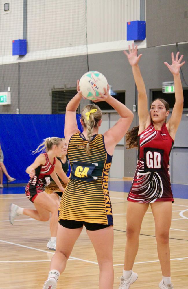 Saints GD Rose Munokoa defends a pass during Premier League netball in Townsville. Picture: Shaantel Hampson / TCNAI