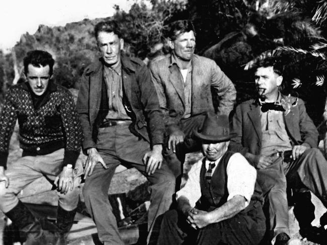 Image from HWT book 'MOMENTS IN TIME'. Portrait gallery. 'Lost reef' champion Harold Bell Lasseter (front) with his exploring party in Central Australia. Pic: Argus