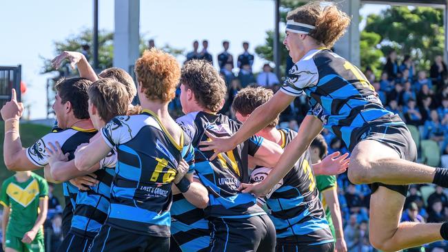 The All Saints Maitland senior rugby league side celebrating during their 38-12 victory over Hunter Sports High in round two of the 2023 Peter Mulholland Cup. Picture: supplied