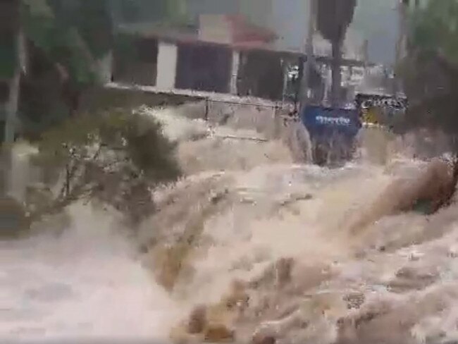 Image grab from video of raging water at Curtis Fall Mt Tamborine