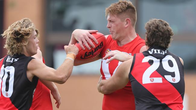 North Adelaide’s Mitch Harvey uses his strength to shrug off West Adelaide’s Hamish Ellem at Prospect Oval on Saturday. Picture: SANFL Image/David Mariuz