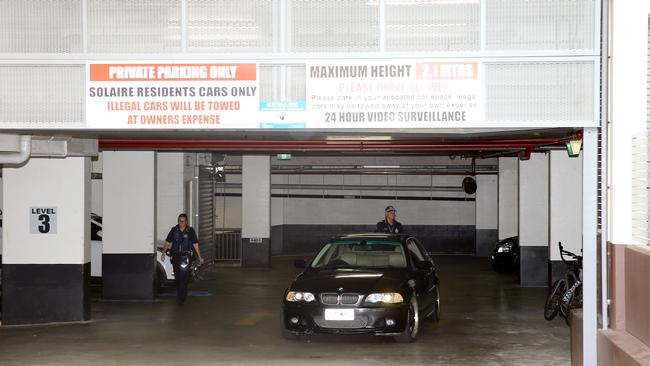 Police at the Solaire Apartments underground carpark where Daniel White-Mayne was shot during a botched arrest. Picture: David Clark