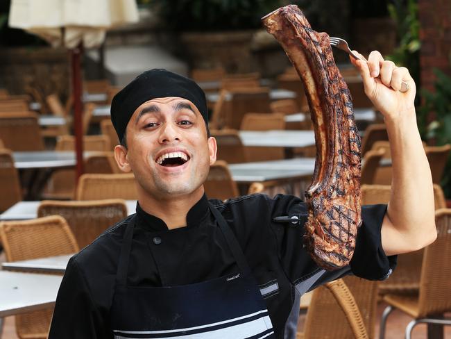 The Tomahawk is a festival of meat. Chef Parvin Basnet pictured with the monster. Picture: Toby Zerna