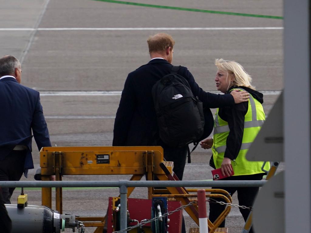 Prince Harry, Duke of Sussex boards a flight at Aberdeen Airport the day after The Queen died. Picture: Getty