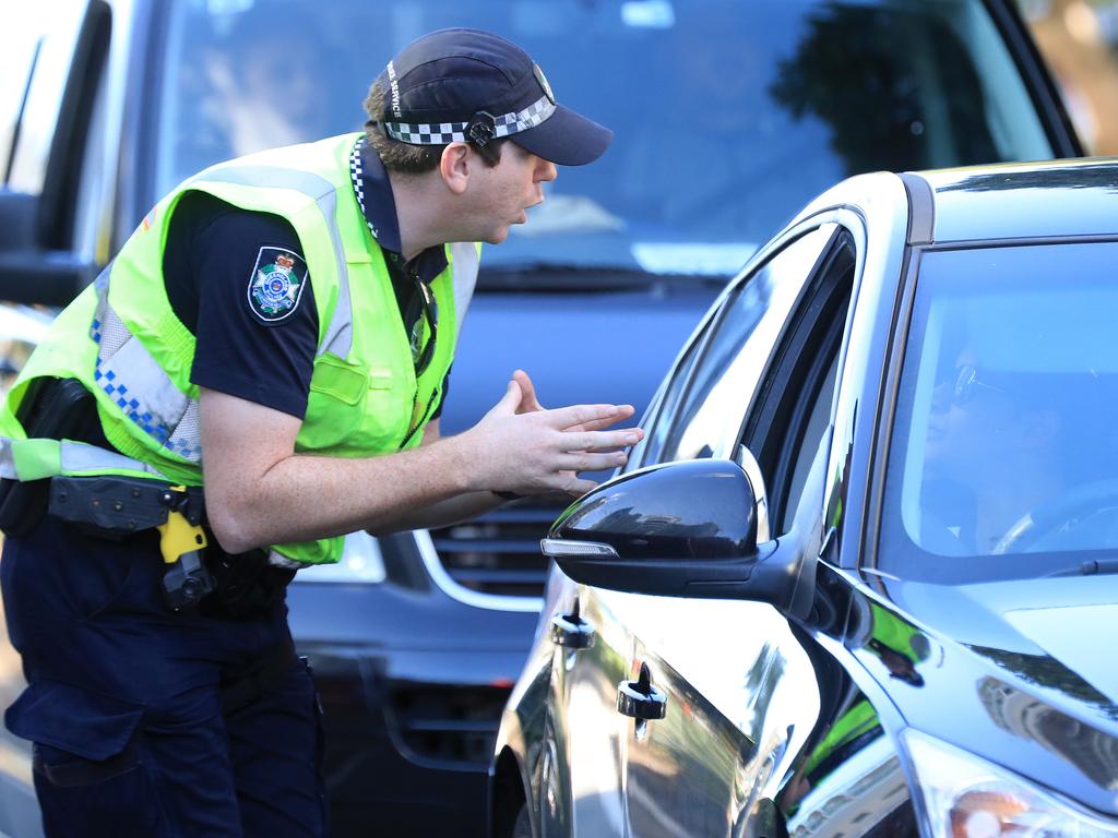 Police check cars at Coolangatta on the Queensland border. Picture: Adam Head