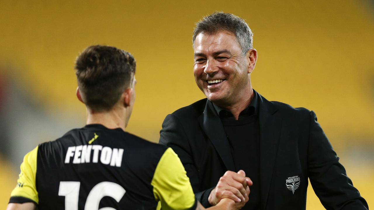 Coach Mark Rudan of the Phoenix embraces Louis Fenton