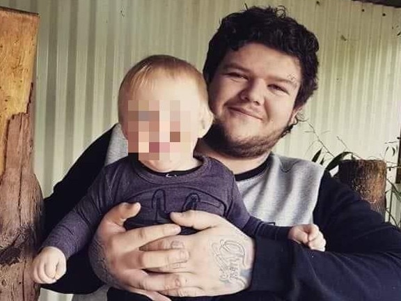 Alleged Burnie murder victim Bobby William Medcraft, 23, pictured with his young son. Picture: Facebook