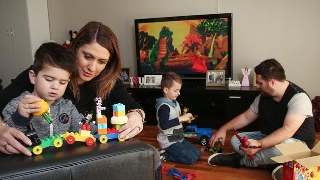 Melissa and husband Nick with Julian, 5, and Jonah, 3. Picture : Ian Currie