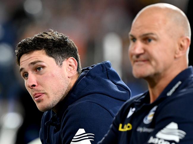 BRISBANE, AUSTRALIA - AUGUST 11: Mitchell Moses of the Eels is seen alongside Coach Brad Arthur and looking dejected after sustaining an injury during the round 24 NRL match between the Brisbane Broncos and Parramatta Eels at The Gabba on August 11, 2023 in Brisbane, Australia. (Photo by Bradley Kanaris/Getty Images)