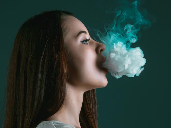 The face of vaping young woman on black studio backgroundIStock imageCredit:master1305 Stock photo ID:687438202Upload date:May 24, 2017