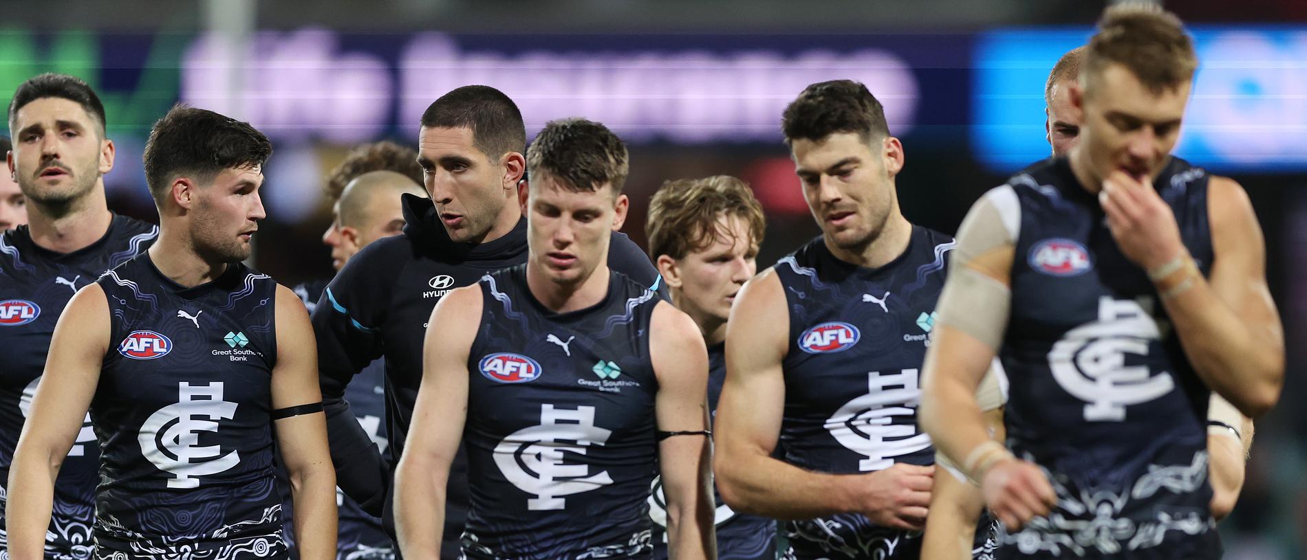 SYDNEY, AUSTRALIA - MAY 17: Blues players look dejected as they walk from the field after defeat during the round 10 AFL match between Sydney Swans and Carlton Blues at SCG, on May 17, 2024, in Sydney, Australia. (Photo by Mark Metcalfe/AFL Photos/via Getty Images)