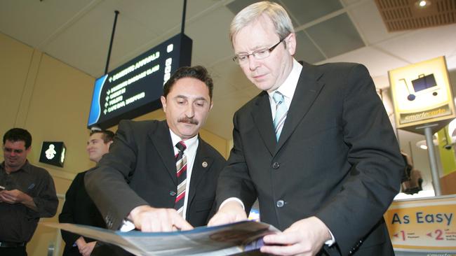 Then-Federal opposition leader Kevin Rudd with local Councillor Eddy Sarroff looking at plans for the light rail at Gold Coast Airport in July 2007.