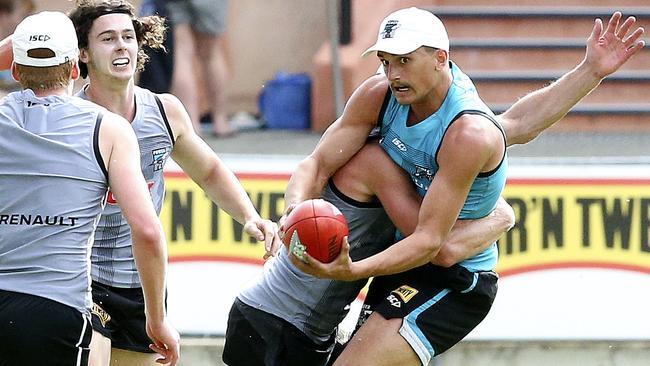 Port Adelaide’s Sam Powell-Pepper gets a handball away at training at Alberton.