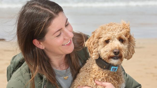 Roamr director Kate Lawrence and dog Charlie with the Roamr GPS tracker. Picture: Alison Wynd