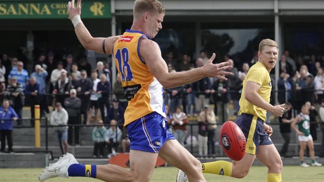 Michael Hurley gets a kick for Macleod. Picture: Valeriu Campan