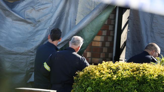 Investigators at the scene of a fatal house fire in Lowood. Picture: Annette Dew