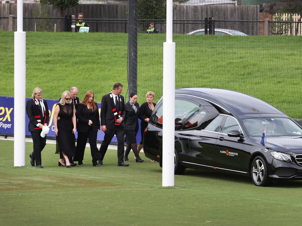 Loved ones escort the hearse on a lap of honour during the funeral service. Picture: David Caird