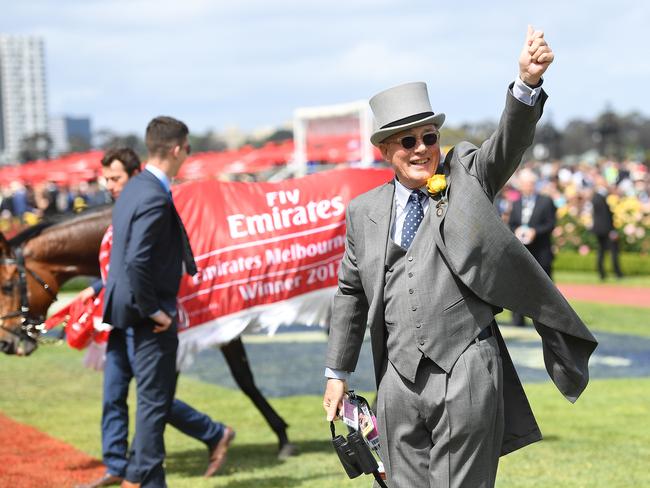 Owner Lloyd Williams gestures with Rekindling after winning the 2017 Melbourne Cup at Flemington Racecourse in Melbourne on Tuesday, November 7, 2017. (AAP Image/Julian Smith) NO ARCHIVING