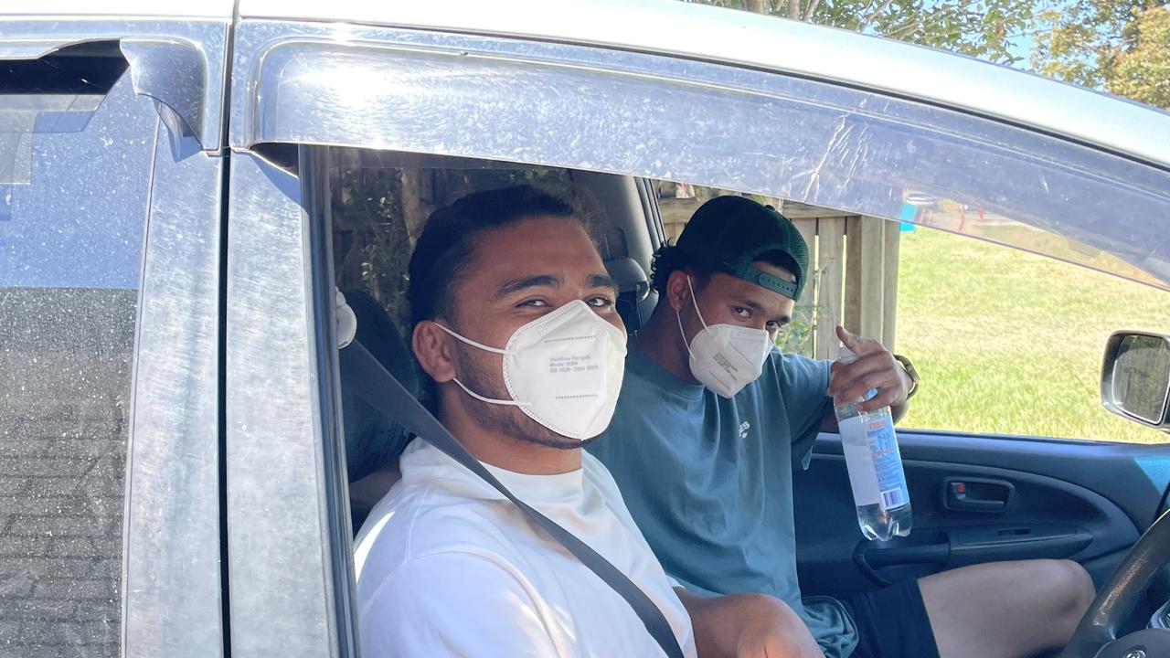 Eels stars Isaiah Papali’i and Hayze Perham lined up to get their drive-through Pfizer jab on the Gold Coast. Picture: Emily Toxward