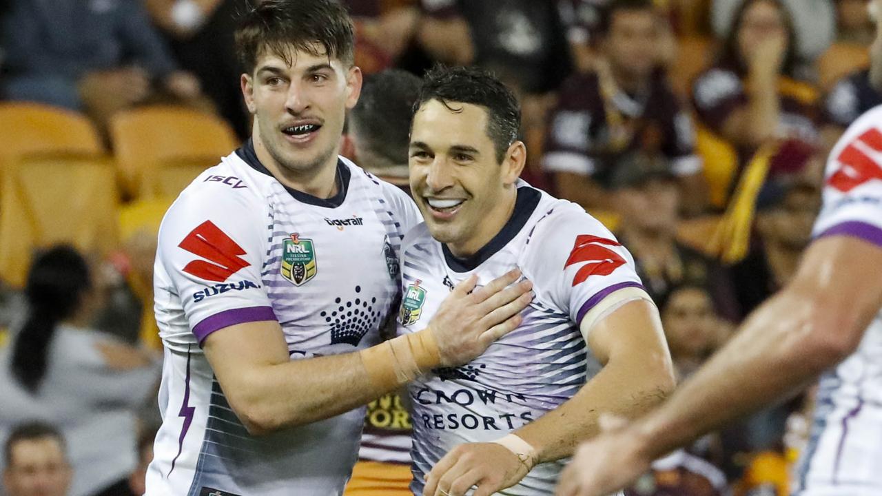Billy Slater of the Storm celebrates with Curtis Scott.