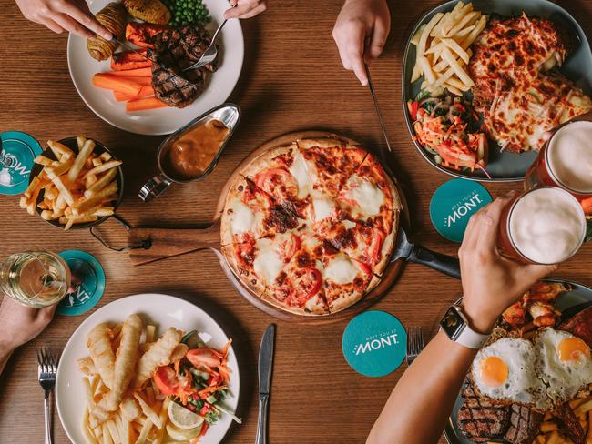 Food at Claremont Hotel (The Mont). clockwise from bottom left:  fish & chips, scotch fillet, parmi, mixed grill and pizza (centre). For Alix Davis Indulge column in TasWeekend. Picture: Supplied
