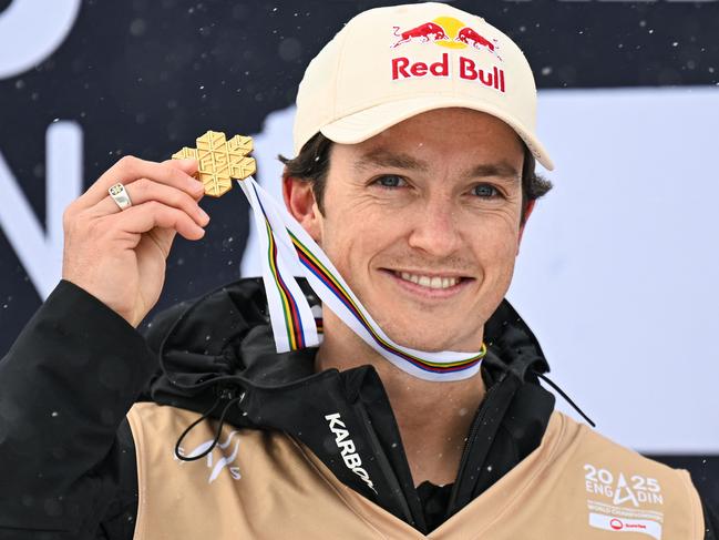 Gold medallist Australia's Scotty James celebrates during the podium ceremony of the Men's Snowboard Halfpipe Final at the FIS Snowboard, Freestyle and Freeski World Championships 2025 in St. Moritz, on March 29, 2025. (Photo by Fabrice COFFRINI / AFP)