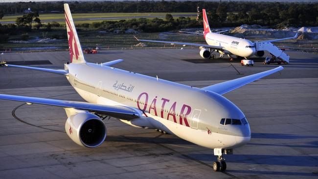 A Qatar Airways plane on the tarmac.