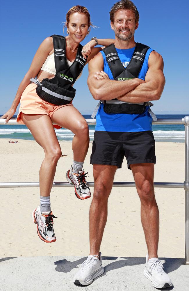 Pip Edwards and Tim Robards participating in the Lift The Load fundraiser challenge at Bondi Beach. Picture: Tim Hunter/The Daily Telegraph.