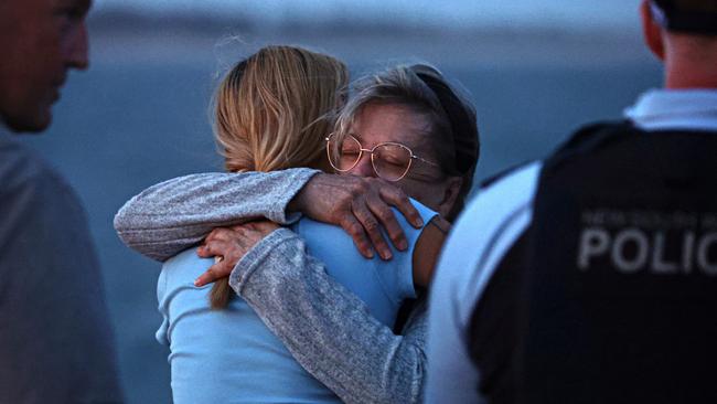 Sally Callahan, the mother of James Callahan, at his memorial on Stockton breakwall. Photographer: Adam Yip