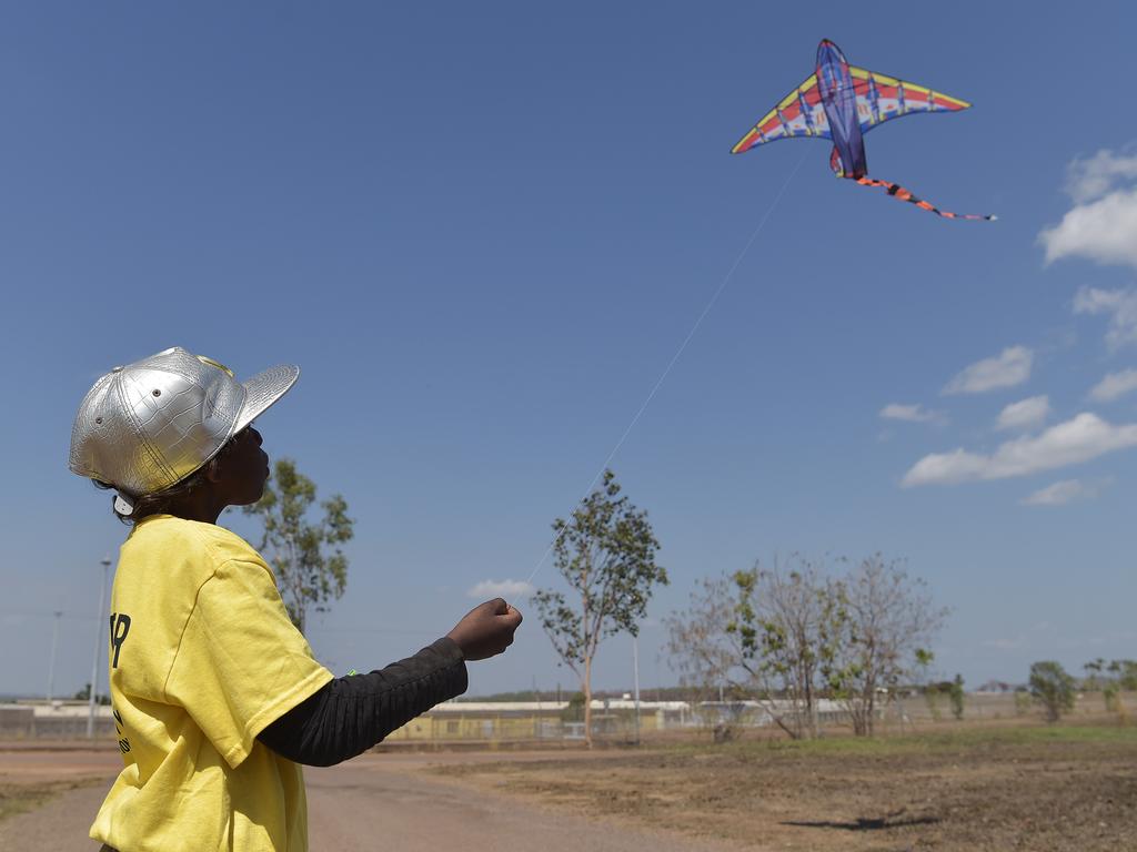 A Palmerston boy flies a kite in front of Don Dale youth detention centre. Picture: Keri Megelus