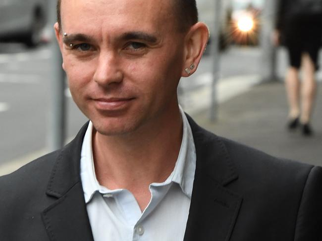 Bryn Hutchinson is seen leaving court after giving evidence at the Downing Centre District Court in Sydney, Monday March 5, 2018. The 37-year-old gave evidence at a civil trial, claiming he was the victim of police brutality, which left him with bruises all over his body. The incident occurred at the 2013 Gay and Lesbian Mardi Gras.  (AAP Image/Peter Rae) NO ARCHIVING.