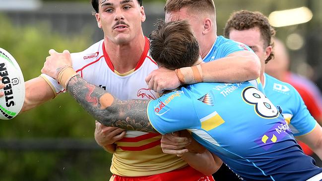 SUNSHINE COAST, AUSTRALIA - FEBRUARY 18: Herbie Farnworth of the Dolphins looks to offload during the NRL Pre-season challenge match between the Dolphins and Gold Coast Titans at Sunshine Coast Stadium on February 18, 2024 in Sunshine Coast, Australia. (Photo by Bradley Kanaris/Getty Images)