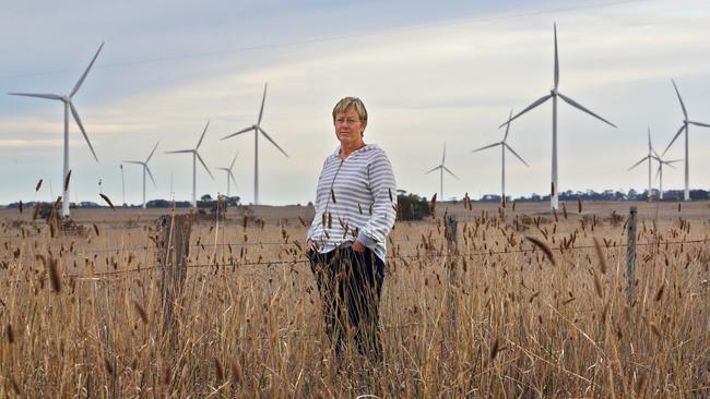 23/3/16 Sue Dean on her property at Mount Egerton, 100km West of Melbourne where there is a wind-farm due to be built on surrounding properties. A wind farm developer in Victoria - Moorabool - is offering to pay neighbours who are not hosting turbines but will live near them lump sum and annual payments worth tens of thousands of dollars. The catch is they must give away all rights to object or complain - allow the company to break the noise limits on it planning permissions - give the company a lean on their property - only sell the property to someone who accepts the agreement - and never, ever talk to the media. The company says it is a "good Neighbour" policy to spread the love. Aaron Francis/The Australian