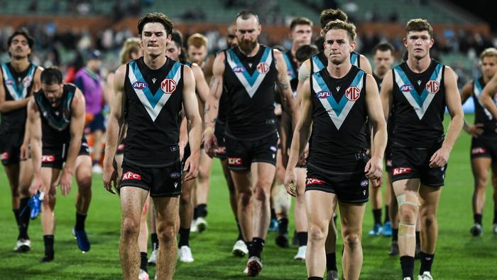 ADELAIDE, AUSTRALIA - SEPTEMBER 05: Port Adelaide leave the ground after losing  the AFL Second Qualifying Final match between Port Adelaide Power and Geelong Cats at Adelaide Oval, on September 05, 2024, in Adelaide, Australia. (Photo by Mark Brake/Getty Images)