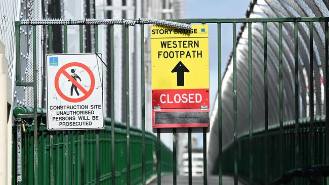 Signs advising of the footpath closures on the Story Bridge. Pic: Lyndon Mechielsen/Courier Mail