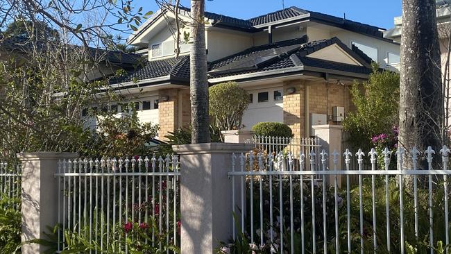 The fence the wife and children of an alleged knifemen shot by police leapt to get to safety. Picture: Samantha Scott