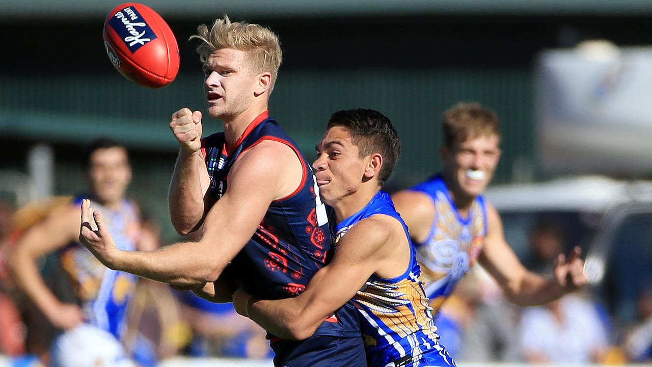 Corey Wagner is tackled by Jarrod Cameron. Picture: Mark Stewart