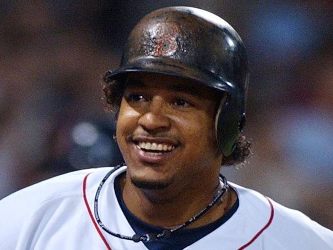 Boston Red Sox' Manny Ramirez smiles as he heads back to the dugout after his home run at Fenway Park in Boston May 21, 2004.  The home run broke a 5-5 tie.  (AP PicCharles/Krupa) sport baseball action o/seas