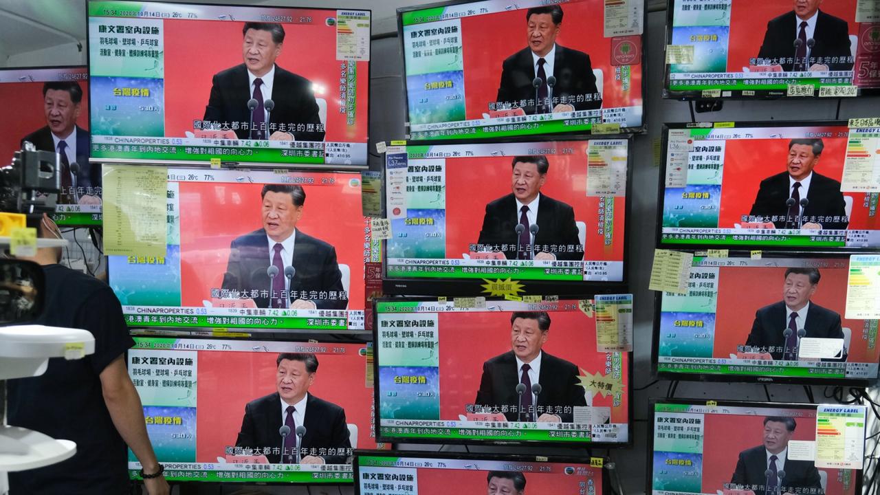 A news report on Chinese President Xi Jinping's speech in the city of Shenzhen is shown on television screens inside a store in Hong Kong, China. Picture: Roy Liu/Bloomberg