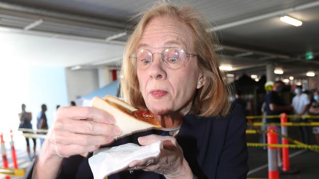 Jeannette Young with a sausage on bread at Bunnings last year. Picture: Annette Dew