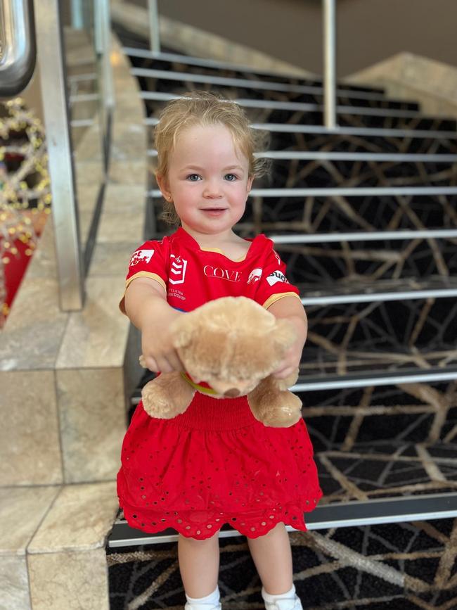 Charlotte Ray, 2, of Redcliffe enjoying the Dolphin's debut NRL game against the Sydney Roosters at Suncorp Stadium on Sunday, March 5, 2023. Picture: Jamie-Leigh Ray