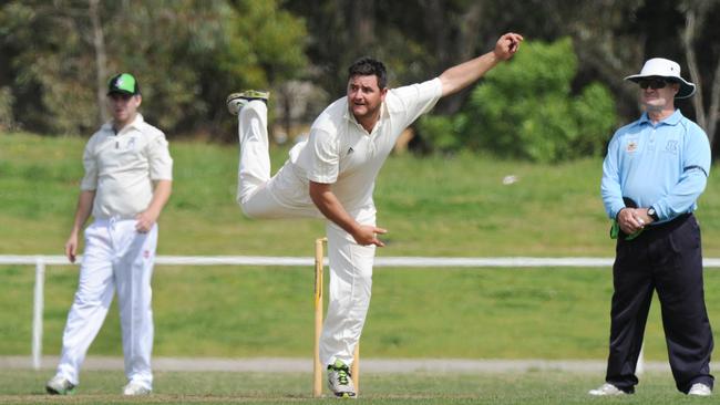 Ryan Hendy bowling for Doveton at Robinson Reserve.