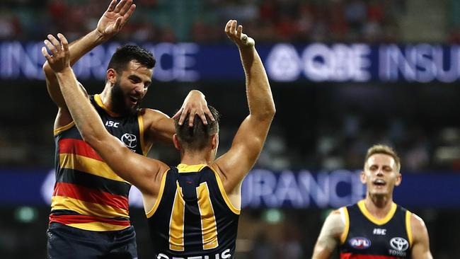 Wayne Milera gets to Paul Seedsman after the midfielder’s long goal. Pic: Getty Images