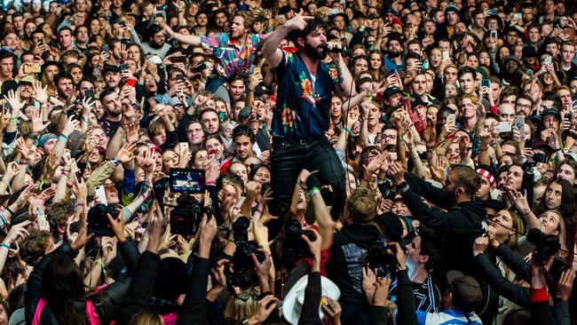 Foals front man Yannis Philippakis ventures out into the crowd during the band's set at Splendour in the Grass 2019.